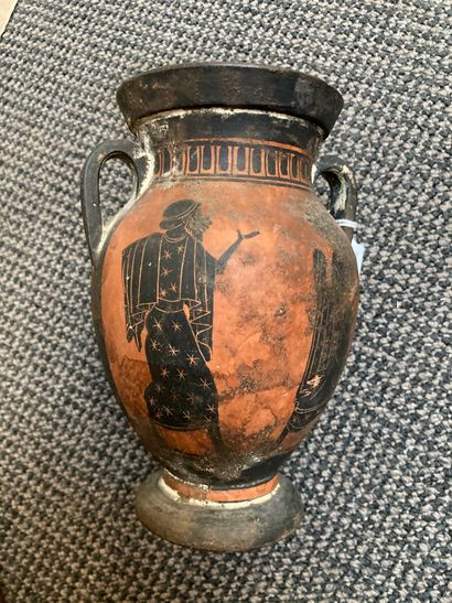 null Small black-figured amphora decorated on one side with three naked ephebes and...