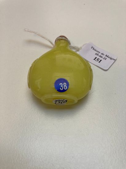 CHINE A flattened piriform snuff bottle in lemon yellow glass with incised handles...