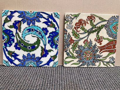 null 
IZNIK 

Nine ceramic wall tiles with polychrome painted decorations of various...