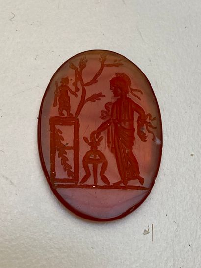 null Large intaglio representing a vestal making an offering in front of a tripod...