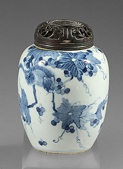 CHINE A small ovoid porcelain vase decorated in blue underglaze with a dormouse among...