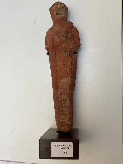 null Shaouabti inscribed on a ventral column. The arms and eyes are modelled.
Modelled...