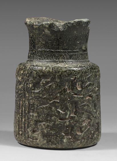  Rare vase with tubular body and high neck. The body is decorated with two curved...