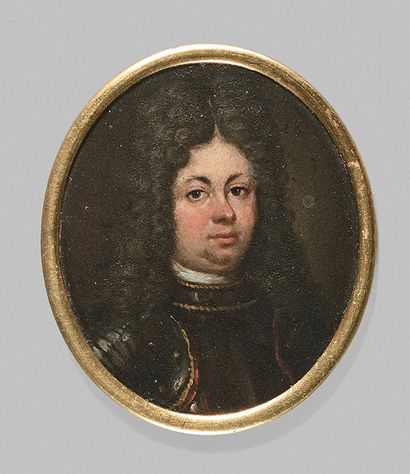 École Française du XVIIe siècle 
Portrait d'homme en armure.
Miniature ovale peinte...
