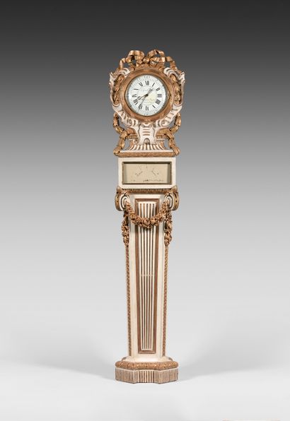 null An important moulded, carved, gilt and cream-coloured wood floor regulator;...