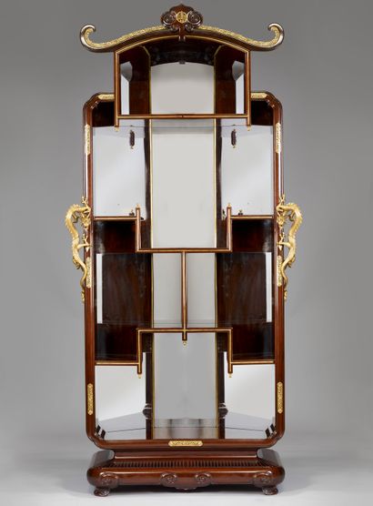 null A rosewood and rosewood veneer display cabinet; of Chinese-inspired architectural...