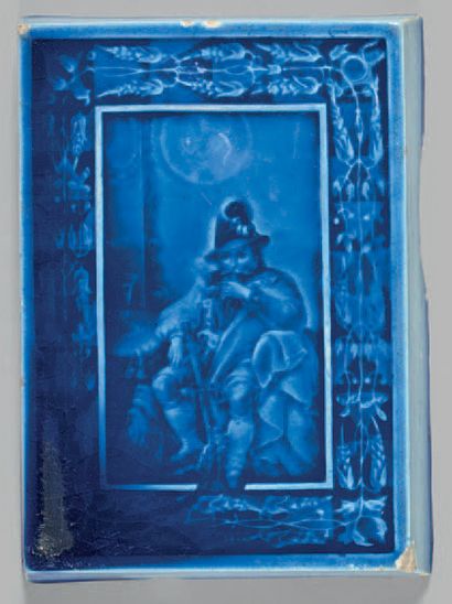 null RUBELLES Rare plaquette rectangulaire en faïence à fond bleu décorée d une scène...