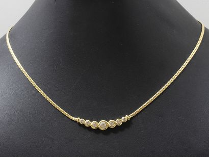 null Necklace in gold 750 thousandths, centered of a braided motive heightened by...