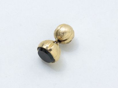null Charm seal in gold 750 thousandths and metal, in the shape of sphere decorated...