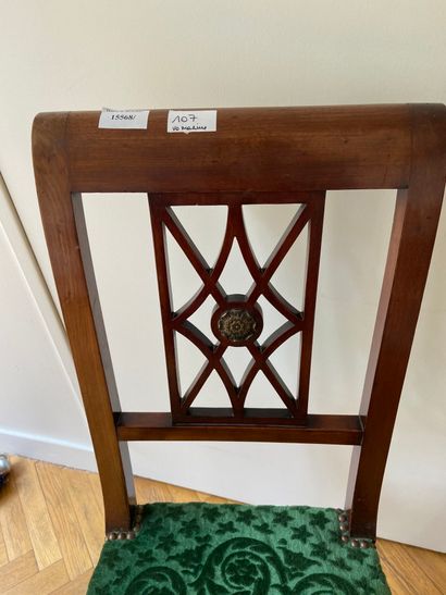 null 
Mahogany and mahogany veneer openwork chair, later sabre legs, green velvet...