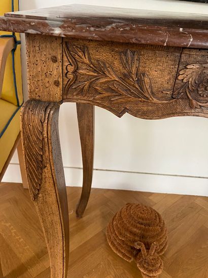 null 
Carved walnut table, 





decoration of scrolls and 





and olive branches,...