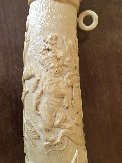 null Ivory oliphant with rich carved hunting decoration and dragon head

Bears the...