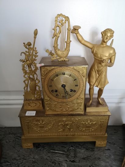 Gilt bronze clock decorated with music attributes....