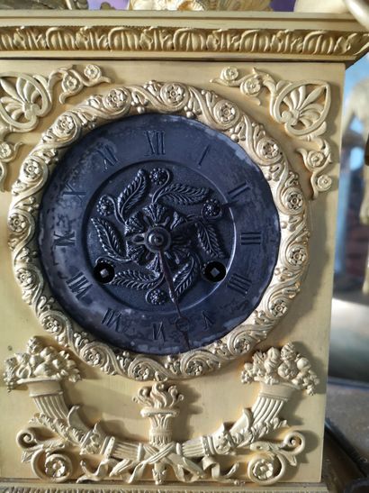 null A clock decorated with Diana the Huntress and a cornucopia. Restoration period....
