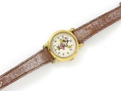 null 
Lot of 3 watches including :

Child's
wrist watch in gilt metal, dial decorated...