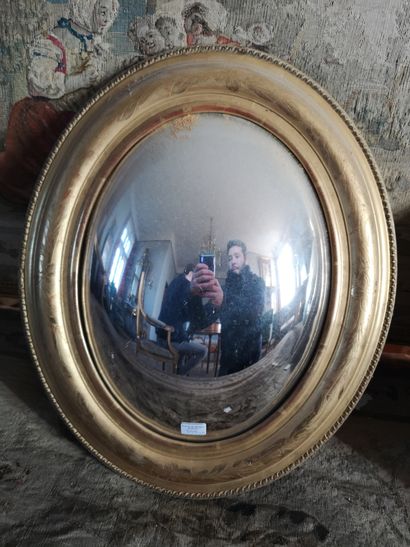 null Pair of oval witch mirrors. End of the XIXth century. Ht 50 x 38 cm. (accidents)....