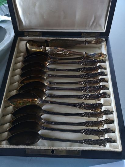 null 
12 Tea spoons in a case, Minerva mark. A pair of sugar tongs in vermeil of...