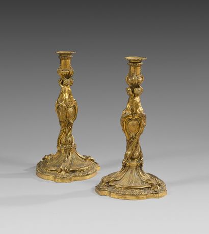 A pair of large chased and gilt bronze torches;...