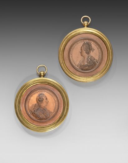 Pair of medallions in bas-relief representing...