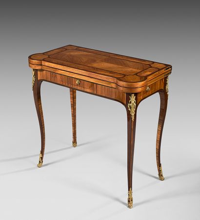 A game table inlaid with rosewood quartefoils...