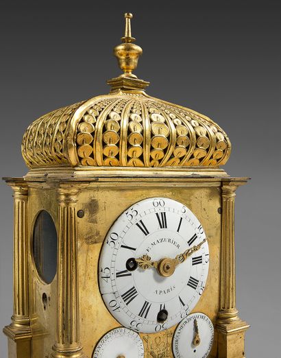 null Rare gilt bronze or copper chased clock. Of architectural form, the cover with...