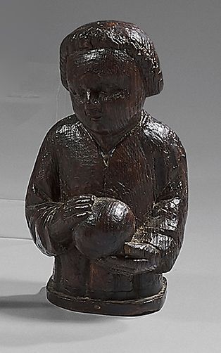 null Carved oak Christ child. The Child is dressed in a tunic and carries in his...
