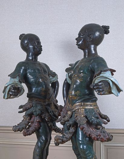 null Pair of carved, lacquered and painted Nubians "au naturel"; they are represented...