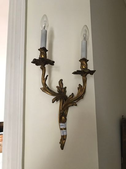  Pair of gilt bronze sconces, two lights mounted with electricity (wear to the gilding)...