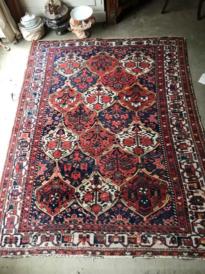  Set of 4 Persian, Bukhara or Caucasus rugs (worn) 
a red and blue background 340...