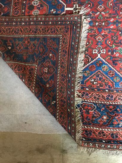  Set of 4 Persian, Bukhara or Caucasus rugs (worn) 
a red and blue background 340...