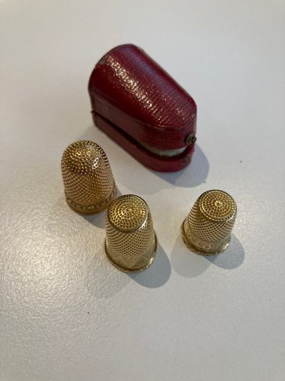 3 gold thimbles 
one joined a case damaged...