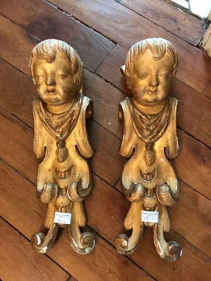 Pair of carved and gilded wood, decorated...