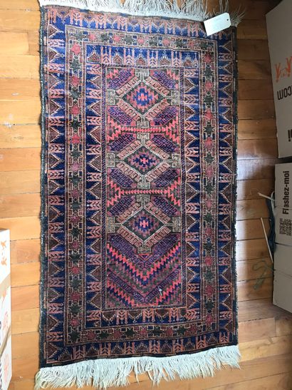 Small Caucasian rug, brown background 
145...