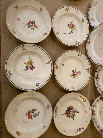null SEVRES. Four porcelain plates with combed edges and polychrome decoration of...