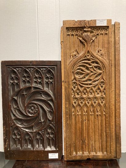 Two carved elements in natural wood, decorated...