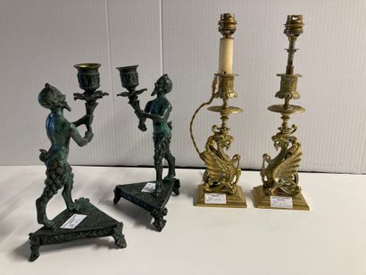 null Two pairs of torches : 

One pair in patinated bronze with satyrs decoration....