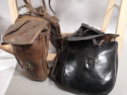 null Old leather saddle. Two pairs of saddlebags are attached, one of which is for...