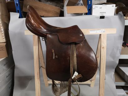 null R. MOTARD. Leather riding saddle with its stirrups. Wear