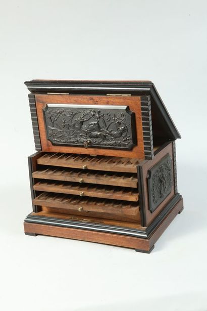 null 
P. Sormani. Cigar cabinet in oak and wood plates with hunting decoration, boar...