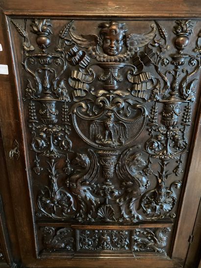 null Set including a cupboard and a bookcase with a shelf. Decorated with carved...