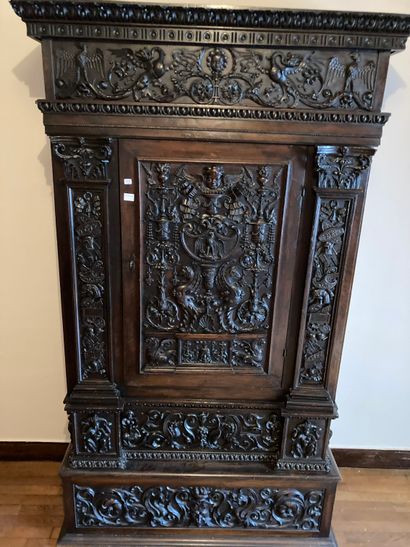 null Set including a cupboard and a bookcase with a shelf. Decorated with carved...
