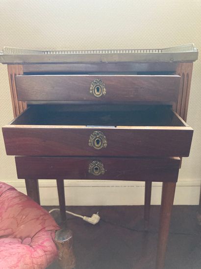 null Lot including a writing table opening by a drawer, a bedside table with marble...