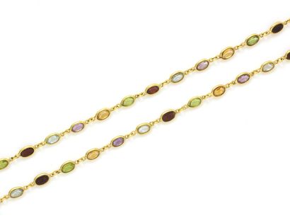 null Necklace in gold 750 thousandths, composed of a line of faceted oval gemstones...