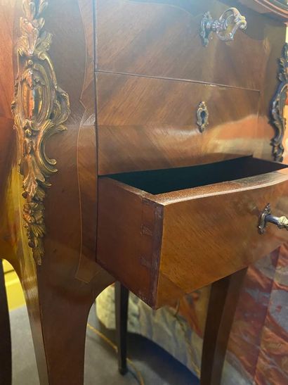 null Bedside table in rosewood veneer, curved legs, opening with three drawers, ornamentation...
