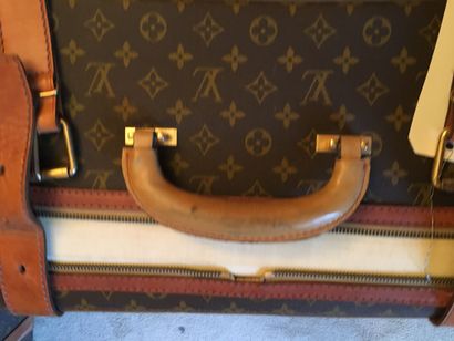 null Two monogrammed suitcases (accidents and handles redone, stains)

Lot sold as...