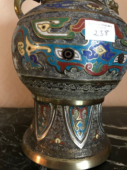 null Ref 67 / China, modern enamelled vase, circa 1900, archaic Taotie mask design

Ht...