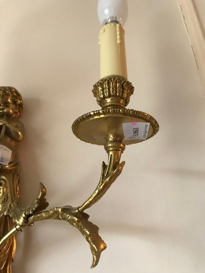 null Ref 61 / Pair of gilt bronze two-light sconces decorated with blowing children...