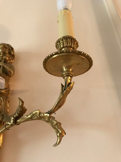 null Ref 61 / Pair of gilt bronze two-light sconces decorated with blowing children...