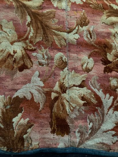 null Carpet decorated with large branches of white and brown leaves on a red background,...