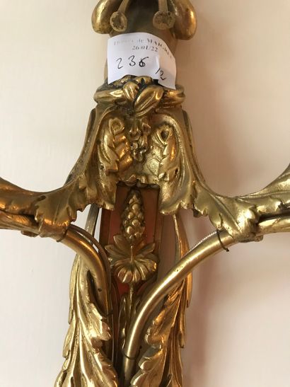 null Ref 61 / Pair of gilt bronze two-light sconces decorated with blowing children...